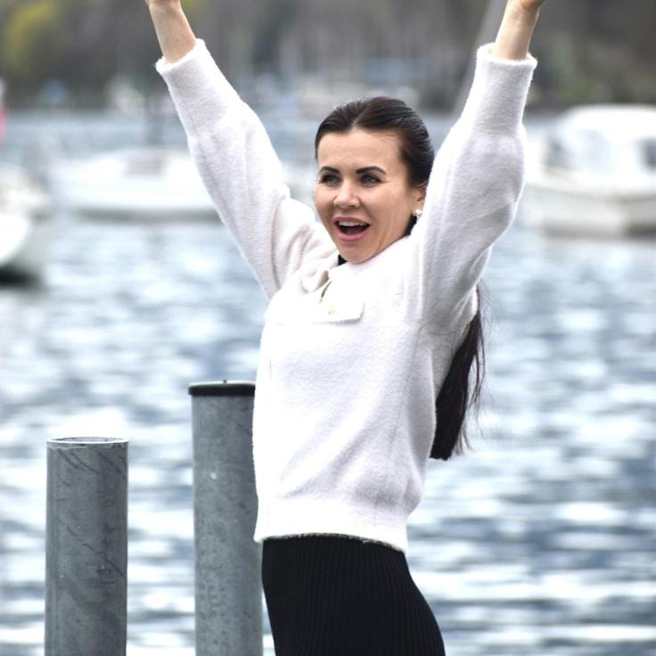 Ana Patel, Lead Design Curator at Simple Mirror Field, reviewing corporate floral arrangements